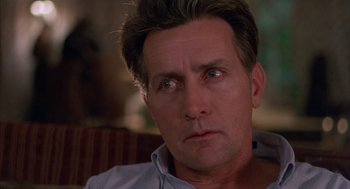 Movie still from “The Believers” (1987), directed by John Schlesinger – A person looking at the camera; Close Up shot, Low angle