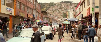 Movie still from “The Belko Experiment” (2016), directed by Greg McLean – A group of people walking down a street next to cars; Extreme Wide shot, High angle