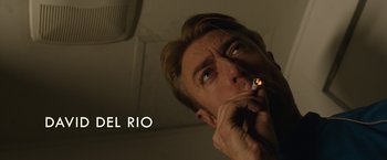 Movie still from “The Belko Experiment” (2016), directed by Greg McLean – A person lighting a cigarette; Extreme Close Up shot, Low angle