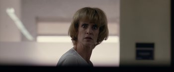 Movie still from “The Belko Experiment” (2016), directed by Greg McLean – A person wearing a white shirt; Close Up shot, Low angle