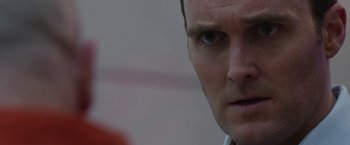 Movie still from “The Belko Experiment” (2016), directed by Greg McLean – A man's face in a room; Close Up shot, Low angle