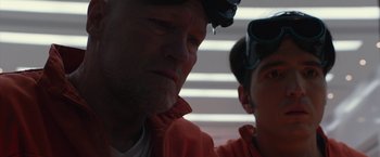 Movie still from “The Belko Experiment” (2016), directed by Greg McLean – A person with a helmet on; Close Up shot, Over the shoulder angle