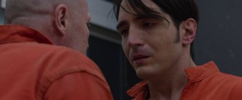 Movie still from “The Belko Experiment” (2016), directed by Greg McLean – A person talking to another person; Close Up shot, Over the shoulder angle