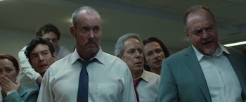 Movie still from “The Belko Experiment” (2016), directed by Greg McLean – A group of men standing next to each other in a room; Medium shot, Low angle