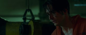 Movie still from “The Belko Experiment” (2016), directed by Greg McLean – A person looking down at something; Close Up shot, High angle