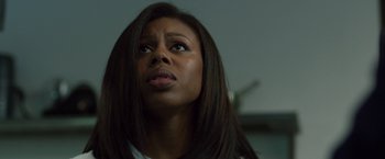 Movie still from “The Belko Experiment” (2016), directed by Greg McLean – A person with long black hair; Close Up shot, Low angle