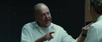 Movie still from “The Belko Experiment” (2016), directed by Greg McLean – An older man in a white shirt is pointing; Close Up shot, Low angle