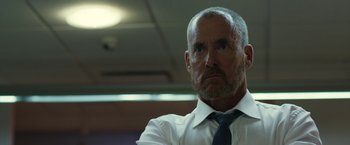 Movie still from “The Belko Experiment” (2016), directed by Greg McLean – A man in a white shirt and a blue tie; Close Up shot, Low angle