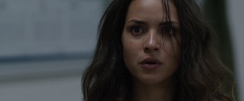 Movie still from “The Belko Experiment” (2016), directed by Greg McLean – A person with long hair; Close Up shot, Over the shoulder angle