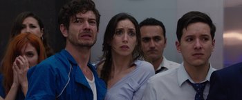 Movie still from “The Belko Experiment” (2016), directed by Greg McLean – A group of people standing next to each other in a room; Close Up shot, Over the shoulder angle
