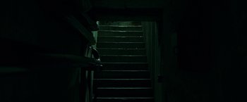 Movie still from “The Belko Experiment” (2016), directed by Greg McLean – The stairs lead up to the top of the building; Wide shot, High angle