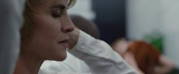 Movie still from “The Belko Experiment” (2016), directed by Greg McLean – A person wearing a white dress shirt; Close Up shot, Over the shoulder angle