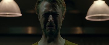 Movie still from “The Belko Experiment” (2016), directed by Greg McLean – A person with his eyes closed; Close Up shot, Low angle