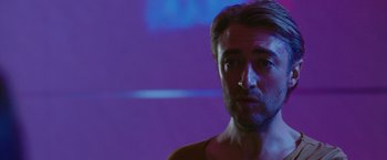 Movie still from “The Belko Experiment” (2016), directed by Greg McLean – A person wearing a shirt; Close Up shot, Low angle