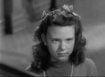 Movie still from “The Bells of St. Mary's” (1945), directed by Leo McCarey – A black and white photo of a young girl; Close Up shot, High angle