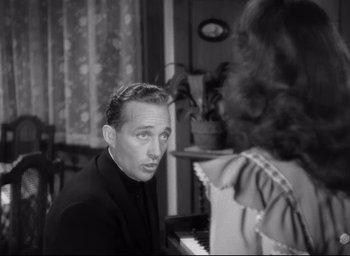 Movie still from “The Bells of St. Mary's” (1945), directed by Leo McCarey – A black and white photo of a man and a woman; Close Up shot, High angle