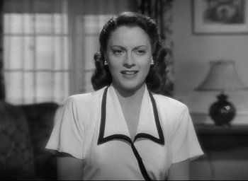 Movie still from “The Bells of St. Mary's” (1945), directed by Leo McCarey – An old photo of a woman smiling for the camera; Medium shot, Low angle