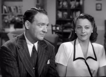 Movie still from “The Bells of St. Mary's” (1945), directed by Leo McCarey – An older man and a younger woman are sitting together; Medium shot, Low angle