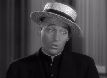 Movie still from “The Bells of St. Mary's” (1945), directed by Leo McCarey – A black and white photo of a man wearing a straw hat; Close Up shot, High angle