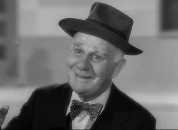 Movie still from “The Bells of St. Mary's” (1945), directed by Leo McCarey – An older man wearing a hat and a bow tie; Close Up shot, Low angle