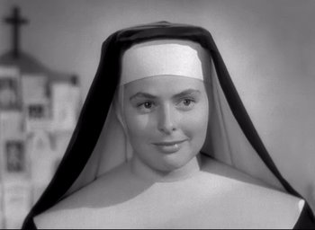 Movie still from “The Bells of St. Mary's” (1945), directed by Leo McCarey – A woman wearing a nun's outfit and a white hat; Close Up shot, Low angle