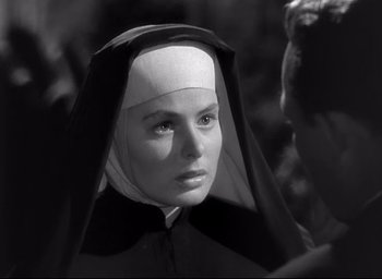 Movie still from “The Bells of St. Mary's” (1945), directed by Leo McCarey – A woman wearing a nun's habit and a white head covering; Close Up shot, Over the shoulder angle