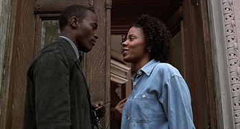 Movie still from “The Best Man” (1999), directed by Malcolm D. Lee – A man and a woman talking to each other; Close Up shot, Low angle