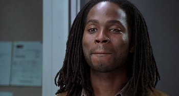 Movie still from “The Best Man” (1999), directed by Malcolm D. Lee – A person with long dreadlocks; Close Up shot, Over the shoulder angle
