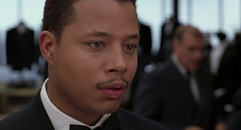 Movie still from “The Best Man” (1999), directed by Malcolm D. Lee – A person wearing a suit and tie; Close Up shot, Over the shoulder angle
