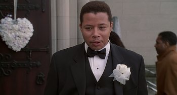 Movie still from “The Best Man” (1999), directed by Malcolm D. Lee – A man in a suit and a bow tie; Close Up shot, Low angle