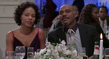 Movie still from “The Best Man” (1999), directed by Malcolm D. Lee – A man and a woman sitting at a dinner table; Close Up shot, Over the shoulder angle