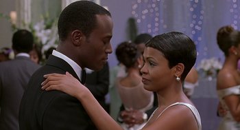 Movie still from “The Best Man” (1999), directed by Malcolm D. Lee – A man and a woman dancing together at a party; Medium shot, Over the shoulder angle