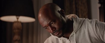Movie still from “The Best Man Holiday” (2013), directed by Malcolm D. Lee – A man with a bald head looking to his left; Close Up shot, High angle