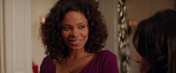 Movie still from “The Best Man Holiday” (2013), directed by Malcolm D. Lee – A person wearing a purple shirt; Close Up shot, Over the shoulder angle