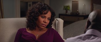 Movie still from “The Best Man Holiday” (2013), directed by Malcolm D. Lee – A person sitting in a chair; Close Up shot, Over the shoulder angle