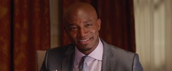 Movie still from “The Best Man Holiday” (2013), directed by Malcolm D. Lee – A person wearing a suit and tie; Close Up shot, Over the shoulder angle