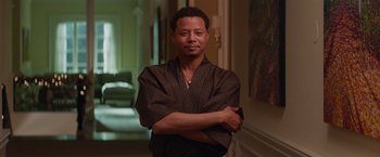 Movie still from “The Best Man Holiday” (2013), directed by Malcolm D. Lee – A man standing in a room with his arms crossed; Medium shot, Over the shoulder angle