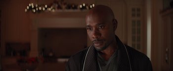 Movie still from “The Best Man Holiday” (2013), directed by Malcolm D. Lee – A person wearing a jacket; Close Up shot, Over the shoulder angle
