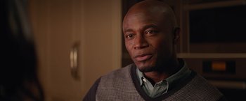 Movie still from “The Best Man Holiday” (2013), directed by Malcolm D. Lee – A person wearing a sweater; Close Up shot, Over the shoulder angle