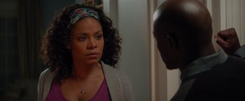 Movie still from “The Best Man Holiday” (2013), directed by Malcolm D. Lee – A woman standing next to a man in front of a mirror; Close Up shot, Over the shoulder angle