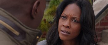 Movie still from “The Best Man Holiday” (2013), directed by Malcolm D. Lee – An african american woman looking at another person; Close Up shot, Over the shoulder angle