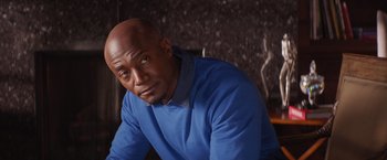 Movie still from “The Best Man Holiday” (2013), directed by Malcolm D. Lee – A man in a blue shirt is looking at the camera; Close Up shot, Low angle