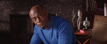 Movie still from “The Best Man Holiday” (2013), directed by Malcolm D. Lee – A man in a blue shirt is looking at the camera; Close Up shot, Low angle