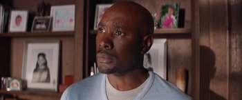 Movie still from “The Best Man Holiday” (2013), directed by Malcolm D. Lee – A man with a bald head is looking at the camera; Close Up shot, Over the shoulder angle