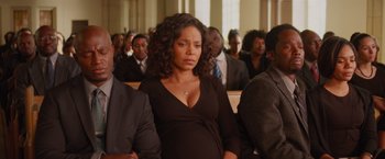 Movie still from “The Best Man Holiday” (2013), directed by Malcolm D. Lee – A woman standing in front of a group of people; Medium shot, High angle