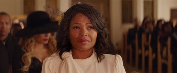 Movie still from “The Best Man Holiday” (2013), directed by Malcolm D. Lee – A person wearing a white shirt; Close Up shot, Over the shoulder angle
