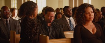 Movie still from “The Best Man Holiday” (2013), directed by Malcolm D. Lee – A group of people sitting in pews in a church; Medium shot, Over the shoulder angle
