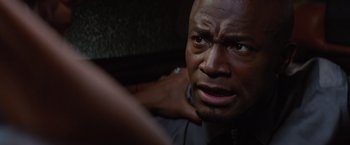 Movie still from “The Best Man Holiday” (2013), directed by Malcolm D. Lee – A person with his hands on his shoulders; Close Up shot, High angle