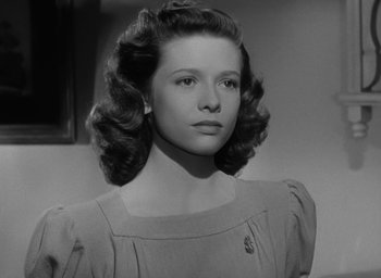 Movie still from “The Best Years of Our Lives” (1946), directed by William Wyler – A black - and - white photo of a young woman; Close Up shot, Low angle