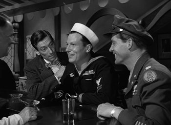 Movie still from “The Best Years of Our Lives” (1946), directed by William Wyler – A group of men sitting around a table; Medium shot, Over the shoulder angle